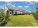 Spacious backyard with an enclosed porch, a well-kept lawn, and manicured landscaping, creating a serene retreat at 333 Dudley Dr, Fort Mill, SC 29715