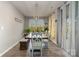 Bright dining room features a farmhouse-style table, stylish light fixture, bench seating and natural light at 333 Dudley Dr, Fort Mill, SC 29715