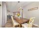 Bright dining room with wood floors, modern lighting, and an open view to the living area at 333 Dudley Dr, Fort Mill, SC 29715