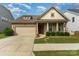 Charming single-story home with a well-manicured lawn, a two-car garage and inviting front porch at 333 Dudley Dr, Fort Mill, SC 29715