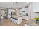 An open-concept kitchen features granite countertops, stainless steel appliances and a central island at 333 Dudley Dr, Fort Mill, SC 29715