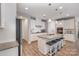 This kitchen boasts granite countertops, stainless steel appliances, a center island, and pendant lighting at 333 Dudley Dr, Fort Mill, SC 29715