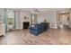 Bright living room with hardwood floors, a fireplace, and modern furnishings at 333 Dudley Dr, Fort Mill, SC 29715