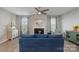 Comfortable living room featuring a fireplace, large windows, and stylish decor at 333 Dudley Dr, Fort Mill, SC 29715