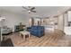 Open-concept living space with hardwood floors and ample natural light overlooking the kitchen at 333 Dudley Dr, Fort Mill, SC 29715