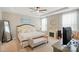 Spacious main bedroom with trey ceiling, carpet, fireplace, bench, and large windows providing natural light at 333 Dudley Dr, Fort Mill, SC 29715