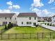 Large, fenced backyard with green grass, a patio, and a view of the two-story house at 3615 Slider Ter, Lancaster, SC 29720