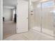 Beautiful tiled walk-in shower with window, bench, and bedroom in the background at 3615 Slider Ter, Lancaster, SC 29720