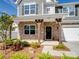 Charming home exterior showcasing stone accents, a covered porch, and manicured landscaping at 3615 Slider Ter, Lancaster, SC 29720