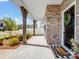 Welcoming front porch with stone pillars, a dark door, and stylish welcome mat at 3615 Slider Ter, Lancaster, SC 29720