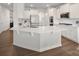 Bright, white kitchen with a large center island, stainless steel appliances, and modern finishes at 3615 Slider Ter, Lancaster, SC 29720