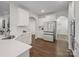 Bright kitchen with white cabinets, stainless steel appliances, and dark hardwood floors at 3615 Slider Ter, Lancaster, SC 29720