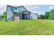 Vast backyard with a playset, a fire pit area, and well-maintained greenery at 3666 Jacinta Ct, Tega Cay, SC 29708