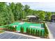 A community basketball court lined with trees and a parking lot at 3666 Jacinta Ct, Tega Cay, SC 29708