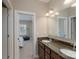 Bathroom vanity featuring dual sinks and granite countertops at 3666 Jacinta Ct, Tega Cay, SC 29708