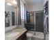 Modern bathroom featuring a glass-enclosed shower, granite countertop, and stylish decor at 3666 Jacinta Ct, Tega Cay, SC 29708