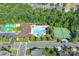Aerial view of the community pool with a slide, area, lounge chairs, and tennis court at 3666 Jacinta Ct, Tega Cay, SC 29708