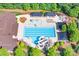 Aerial view of the community pool with a slide, area, and lounge chairs at 3666 Jacinta Ct, Tega Cay, SC 29708