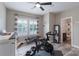 Bright exercise room featuring a ceiling fan, workout equipment, and bathroom access at 3666 Jacinta Ct, Tega Cay, SC 29708