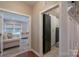 Hallway with natural light entering rooms on either side at 3666 Jacinta Ct, Tega Cay, SC 29708