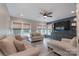 Cozy living room with hardwood floors, large windows, and comfortable furniture at 3666 Jacinta Ct, Tega Cay, SC 29708