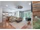 Open-concept living room featuring hardwood floors, stylish furnishings, and abundant natural light at 3666 Jacinta Ct, Tega Cay, SC 29708