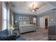 Spacious main bedroom with a tray ceiling, ceiling fan, and ensuite bathroom at 3666 Jacinta Ct, Tega Cay, SC 29708