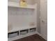 Bright mudroom with built-in bench, storage cubbies, and white wainscoting at 3666 Jacinta Ct, Tega Cay, SC 29708