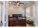 Bright office featuring tray ceilings, plantation shutters, and a built-in desk at 3666 Jacinta Ct, Tega Cay, SC 29708