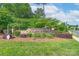 Well-maintained community entrance sign for Lake Ridge with flowers and bushes at 3666 Jacinta Ct, Tega Cay, SC 29708
