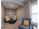 Cozy sitting area with comfortable chairs, ottoman, and natural light at 3666 Jacinta Ct, Tega Cay, SC 29708