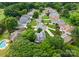 Aerial view of a home surrounded by mature trees and lush landscaping in a well-established neighborhood at 4101 Fairway Downs Ct # 9, Charlotte, NC 28277