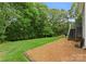 Expansive lawn, enhanced by meticulously placed pine straw, leading to backyard stairs at 4101 Fairway Downs Ct # 9, Charlotte, NC 28277