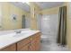Bright bathroom featuring a white vanity, shower-tub combination with white tiles, and modern fixtures at 4101 Fairway Downs Ct # 9, Charlotte, NC 28277
