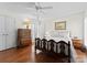 Bright bedroom with hardwood floors, a large window with shutters, and classic wood furnishings at 4101 Fairway Downs Ct # 9, Charlotte, NC 28277