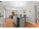 A well-lit dining area featuring a table and chairs that connect seamlessly from the kitchen at 4101 Fairway Downs Ct # 9, Charlotte, NC 28277