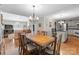 Traditional dining room featuring a wood table, chandelier, and views to the kitchen and living room at 4101 Fairway Downs Ct # 9, Charlotte, NC 28277
