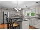 Well-equipped kitchen features modern appliances, granite countertops, and a stylish island at 4101 Fairway Downs Ct # 9, Charlotte, NC 28277