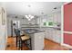 Bright kitchen featuring an island, stainless steel appliances, and hardwood floors at 4101 Fairway Downs Ct # 9, Charlotte, NC 28277