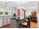 Bright kitchen featuring an island, stainless steel appliances and seamless flow to dining area at 4101 Fairway Downs Ct # 9, Charlotte, NC 28277