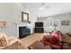 Inviting living room with a fireplace, large windows, and cozy seating arrangement at 4101 Fairway Downs Ct # 9, Charlotte, NC 28277