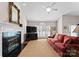 Bright living room showcases a fireplace, large TV, and a cozy seating area at 4101 Fairway Downs Ct # 9, Charlotte, NC 28277