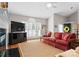 Inviting living room with hardwood floors, plantation shutters, and a comfortable red sofa at 4101 Fairway Downs Ct # 9, Charlotte, NC 28277