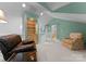 Comfortable loft featuring built-in bookshelves and a cozy seating area with natural light and modern decor at 4101 Fairway Downs Ct # 9, Charlotte, NC 28277