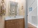 Small powder room featuring a wooden vanity and sink, with a mirror reflecting the room at 4101 Fairway Downs Ct # 9, Charlotte, NC 28277