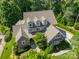 Aerial view of a home showcasing architectural details, a meticulously maintained lawn, and mature trees at 4319 Sailview Dr, Denver, NC 28037