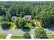 Aerial view of a home with a well-manicured lawn, mature trees, and in a desirable neighborhood at 4319 Sailview Dr, Denver, NC 28037
