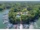 Aerial view of a lake community with private boat slips, a swimming pool, and lush landscaping at 4319 Sailview Dr, Denver, NC 28037