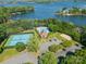 Aerial view of a community featuring a swimming pool, tennis courts, and lake access at 4319 Sailview Dr, Denver, NC 28037