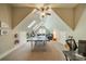 Spacious bonus room featuring a high ceiling, skylights, a ping pong table, and cozy seating area at 4319 Sailview Dr, Denver, NC 28037